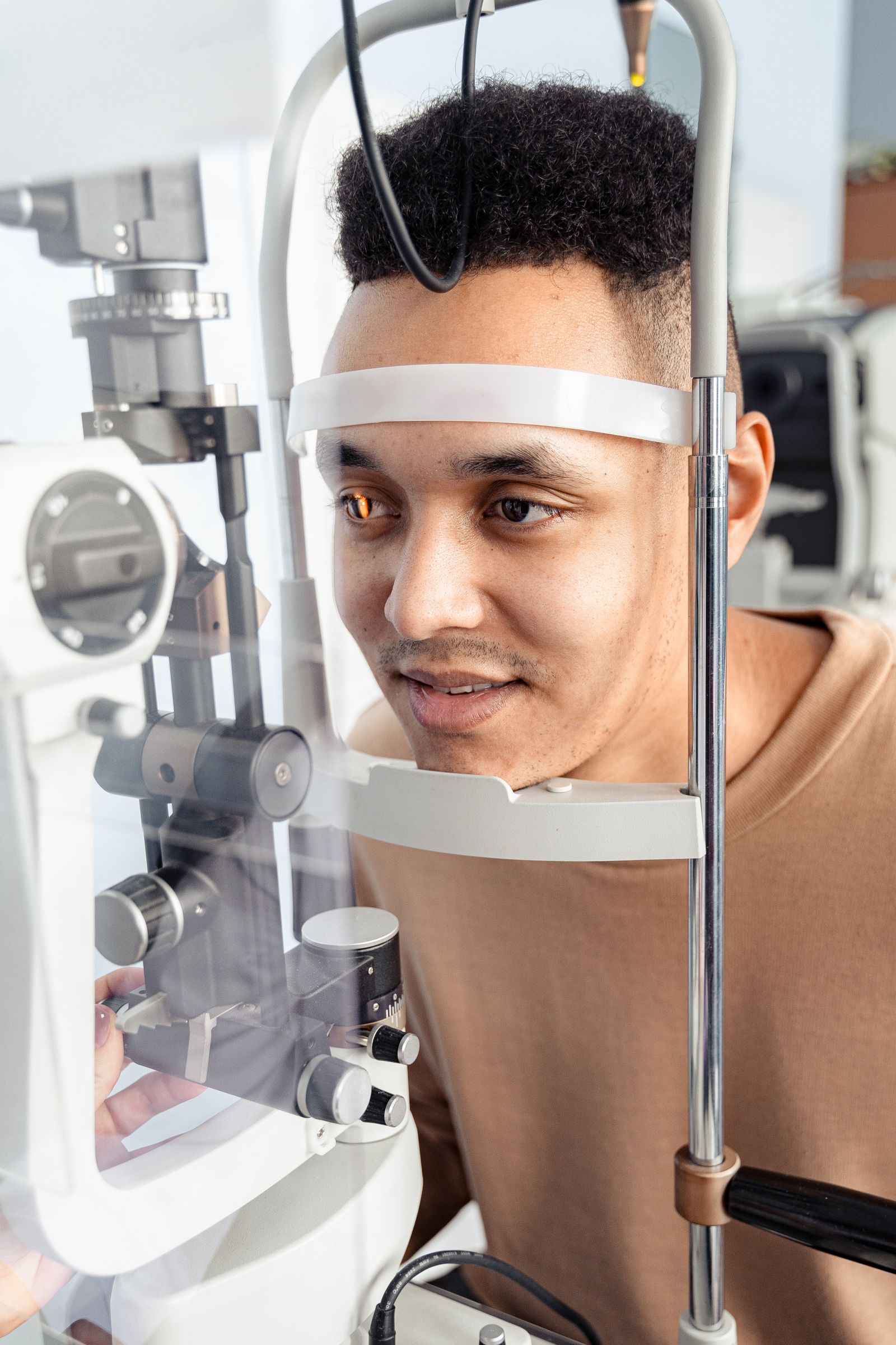 Optometrist performing a comprehensive eye exam on a patient