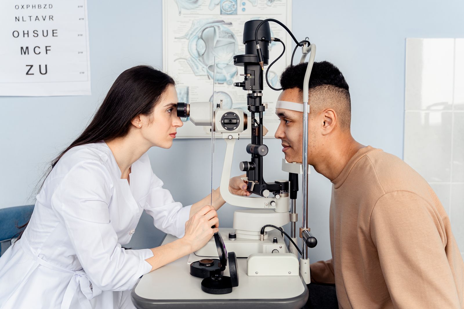 Optometrist performing a comprehensive eye exam on a patient